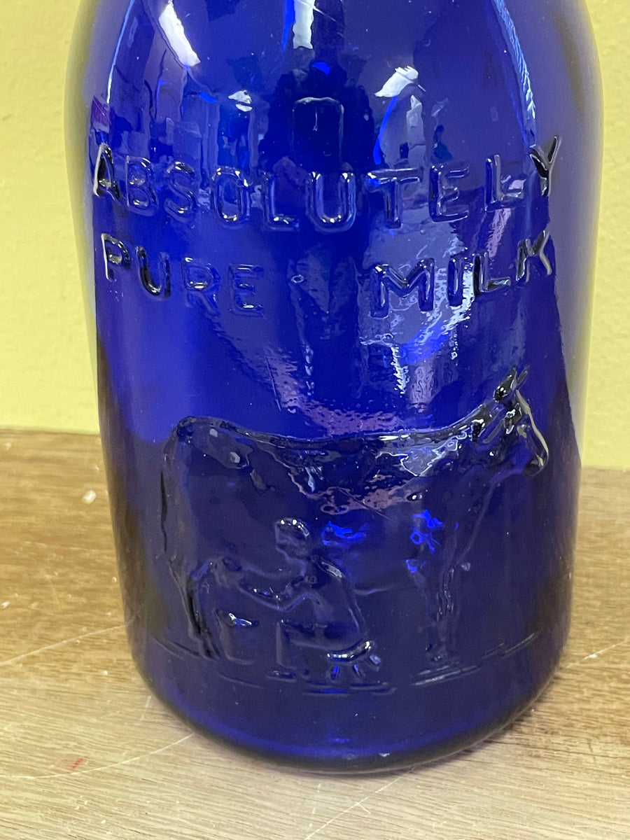 Blue Glass Bottle w/ sealable lid Marked Italy 04