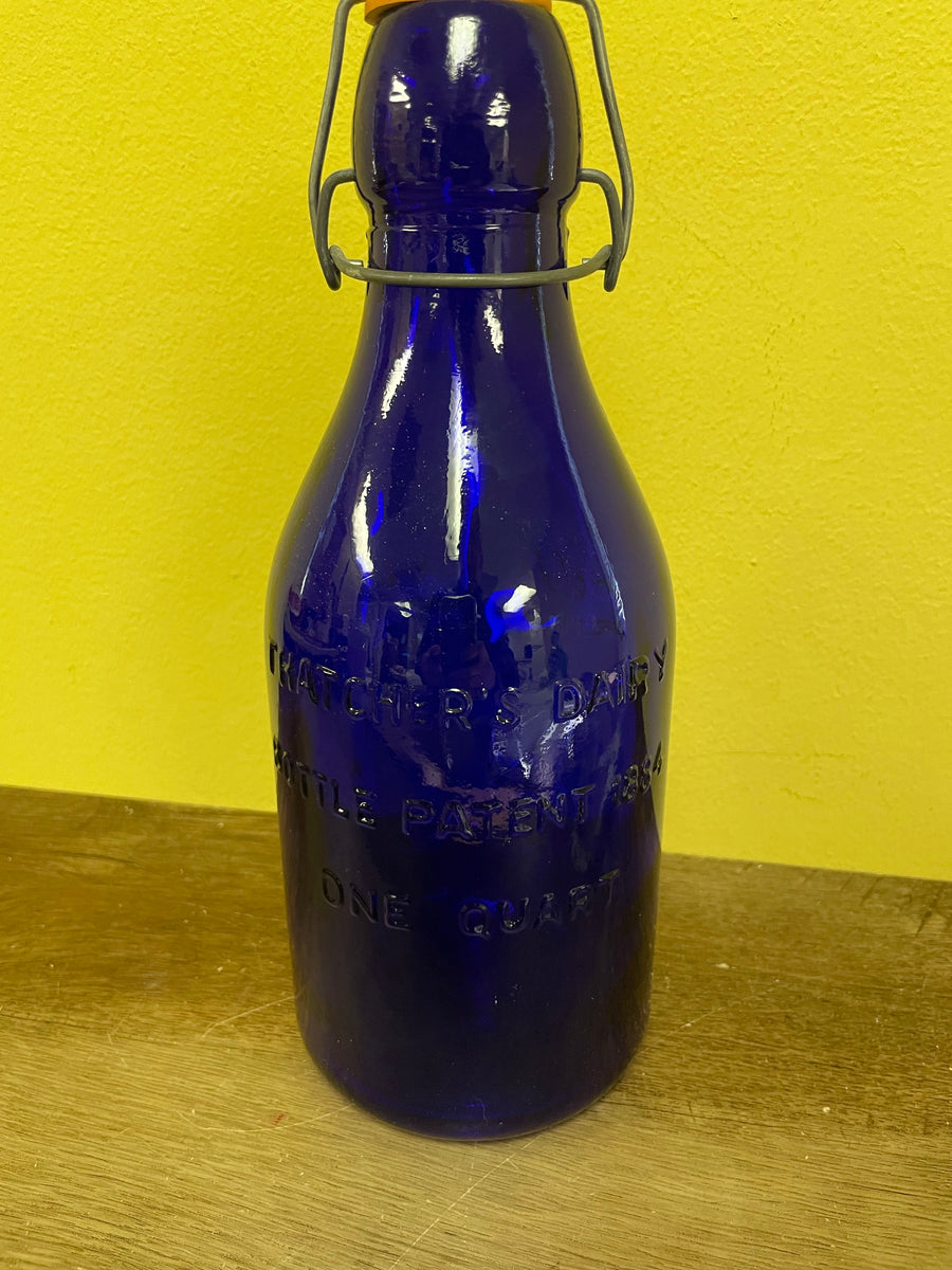 Blue Glass Bottle w/ sealable lid Marked Italy 04