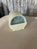 a* Vintage Plastic Tupperware Wagon Wheel Coasters and Holder 567-14