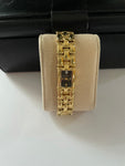 Ladies BULOVA Gold Tone Watch with Black Dial on Gold Plated Bracelete with Diamond Chip Model 97S86