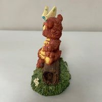 a** Vintage Bear Sitting on Log with Butterfly Decor Resin Figure