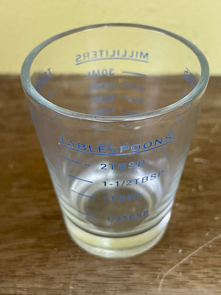 a** Shot Glass Marked Measurements Ounces  Milliliters Teaspoons Tablespoons
