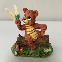 a** Vintage Bear Sitting on Log with Butterfly Decor Resin Figure
