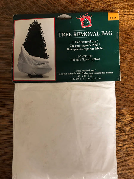 a** Christmas Holiday Tree Removal Bag White 44” x 28” x 90”