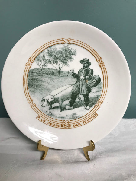 a** Vintage 7.5” A La Recherche Des Truffes Man with Pig Plate