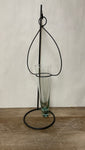 (L) <€€ Hanging Green Glass Bud Vase on Black Metal Stand